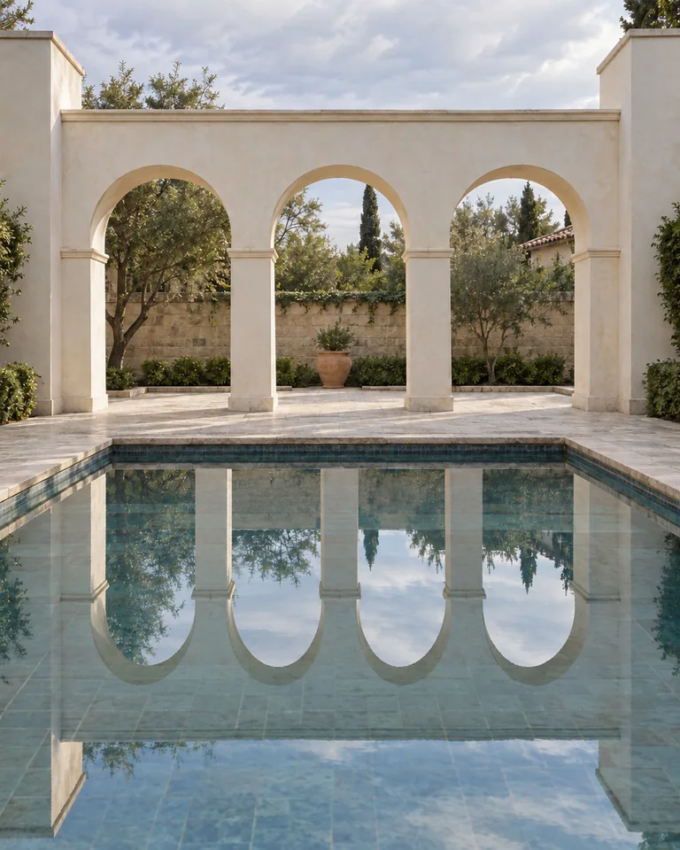 Three arches beside a shallow reflecting pool. The water reflects an extra fourth arch. Original AI-generated architectural fiction.