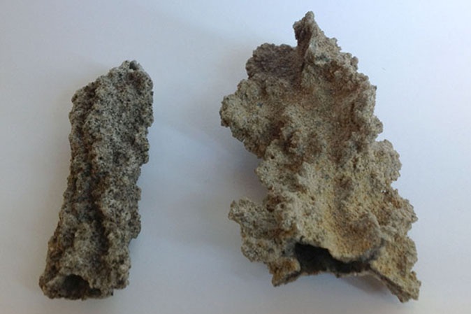 Fulgurite specimens showing sand-coated glass formations