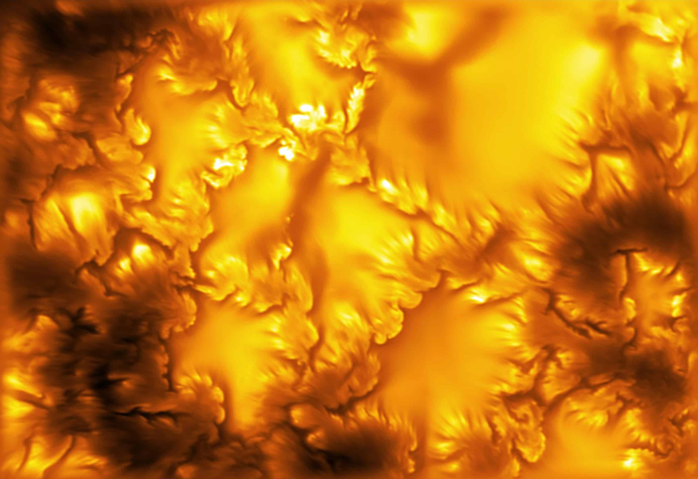 Telescope image of the Sun's surface with fine swirling boundaries around magnetic regions