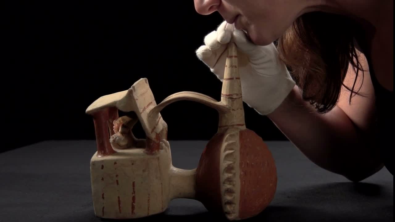 The Lambayeque architectural whistling vessel featured in the museum film — The Metropolitan Museum of Art (2015). Architectural vessel AD 800–1300, Peru, Lambayeque; AMNH B/8285. Actual demonstration and explanatory animation.