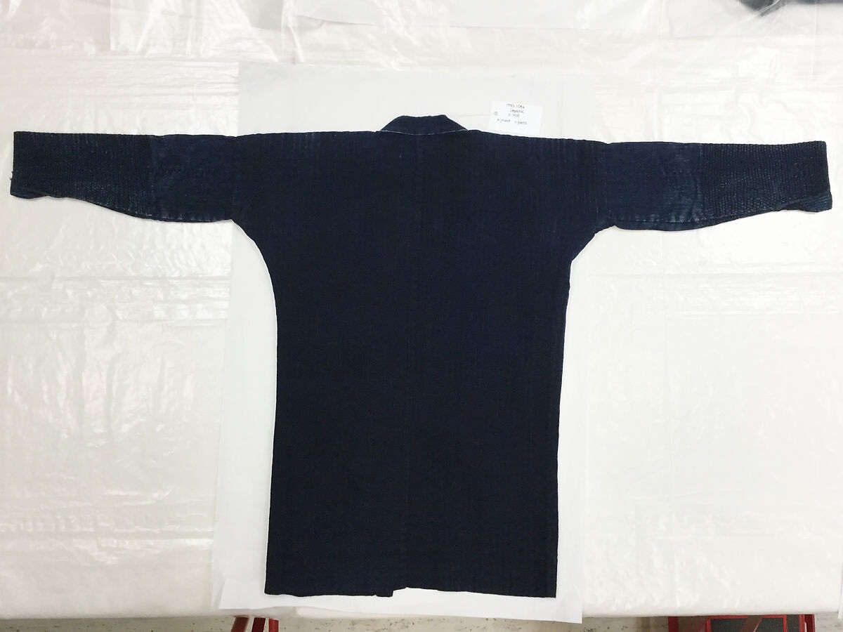 The plain indigo outside of a mid-19th-century Japanese firefighter’s reversible coat