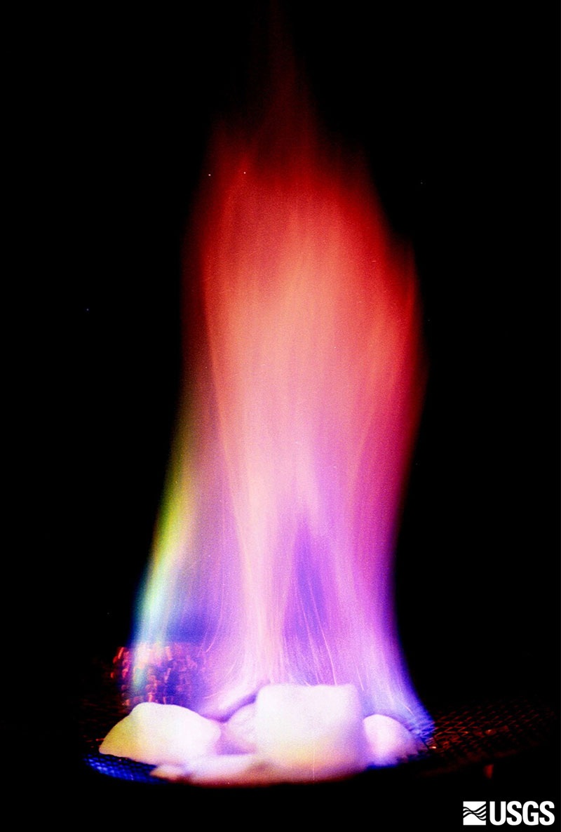 A flame above ice-like methane hydrate during a laboratory demonstration