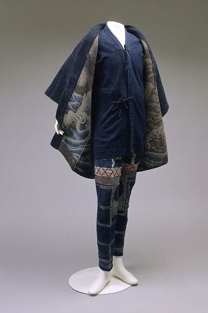 The firefighter’s jacket and patterned trousers displayed together on a mannequin