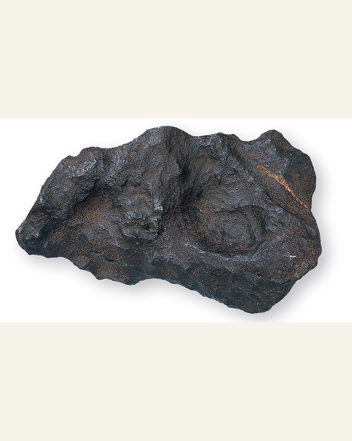 A separate Henbury iron meteorite showing its dark outer fusion crust
