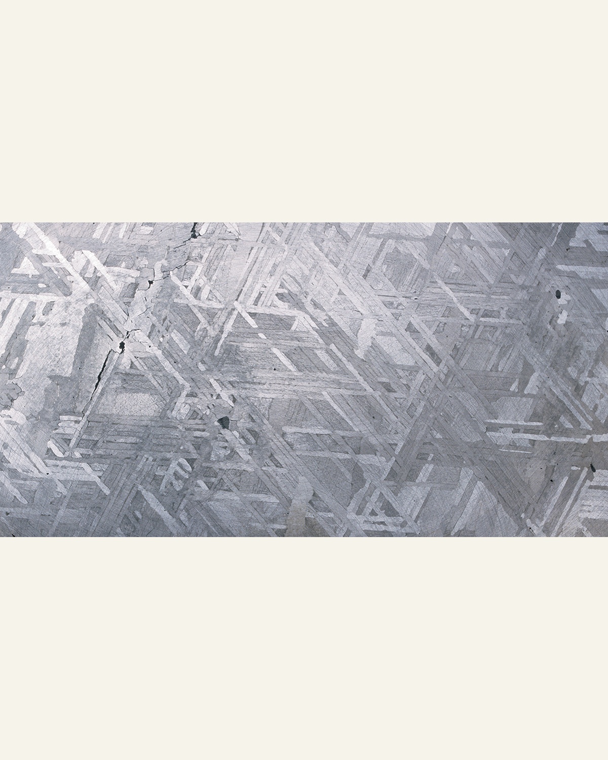 Interlocking crystal bands in the etched surface of a Canyon Diablo iron meteorite