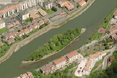Pheasant Island between the French and Spanish riverbanks — Spanish Navy / Ministry of Defence (2012). Original aerial photograph showing Pheasant Island between the two riverbanks.