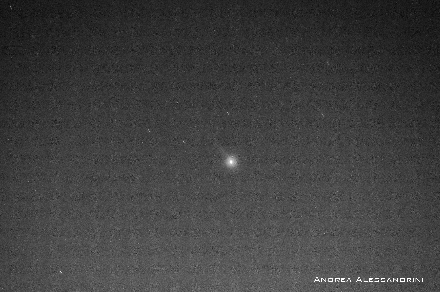 A real filtered long-exposure photograph of Mercury and its sodium tail — Andrea Alessandrini / NASA APOD (2020). Filtered long-exposure photograph of Mercury’s sodium tail; original credit retained.